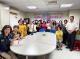 The new immigrant families happily took a group photo with hand-made sachets..JPG