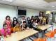 The new immigrant families happily took a group photo with hand-made sachets-1.JPG