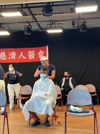 Volunteer hairstylists give foreign crew members a fresh new look before they head back to sea