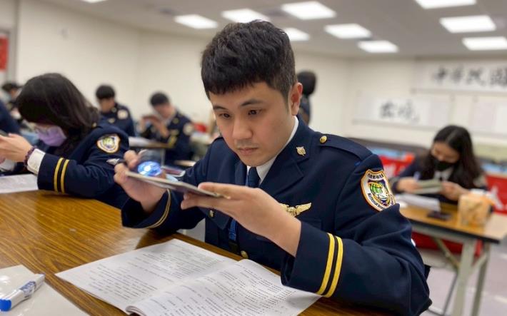 The National Immigration Agency hosts the 15th Document Examination Expert Competition, with immigration officers carefully examining passports to determine their authenticity