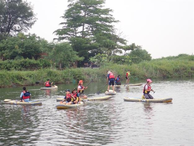 Doing canoe stand-up paddle (SUP) to gain the ultimate experience of the sea-folk