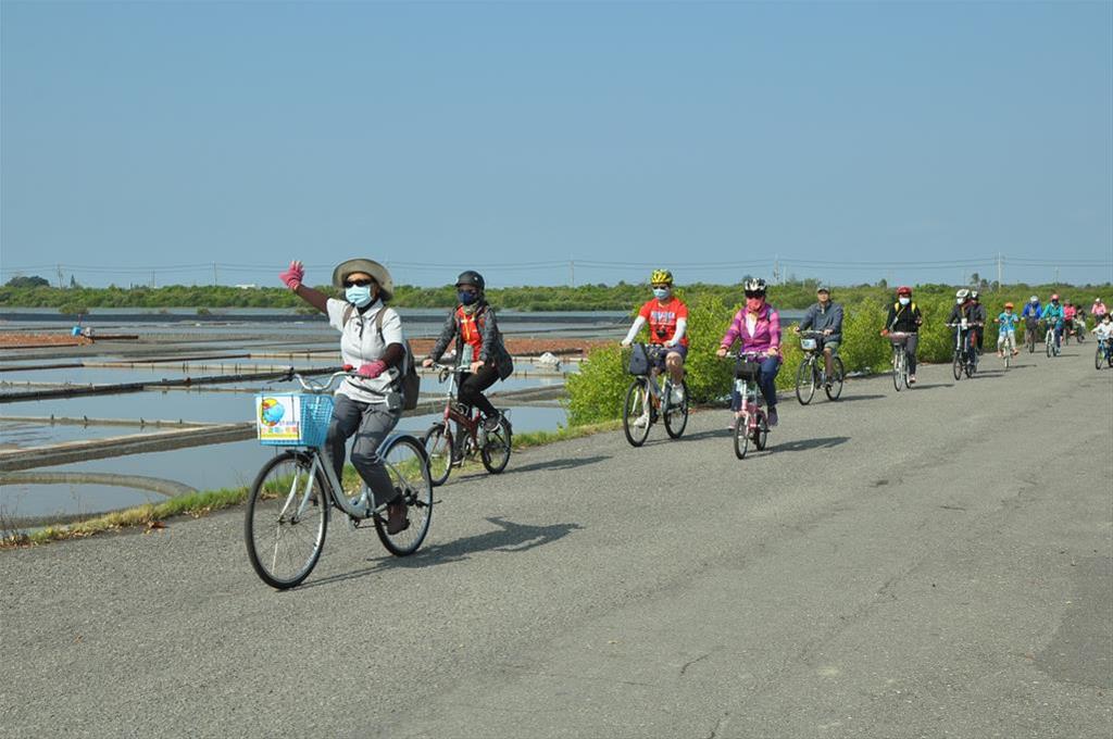 One of the cycling groups riding through the scenic salt fields and wetlands of Anshun