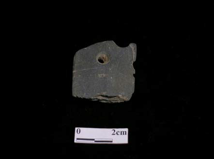 Prehistoric relic of perforated stone arrow head